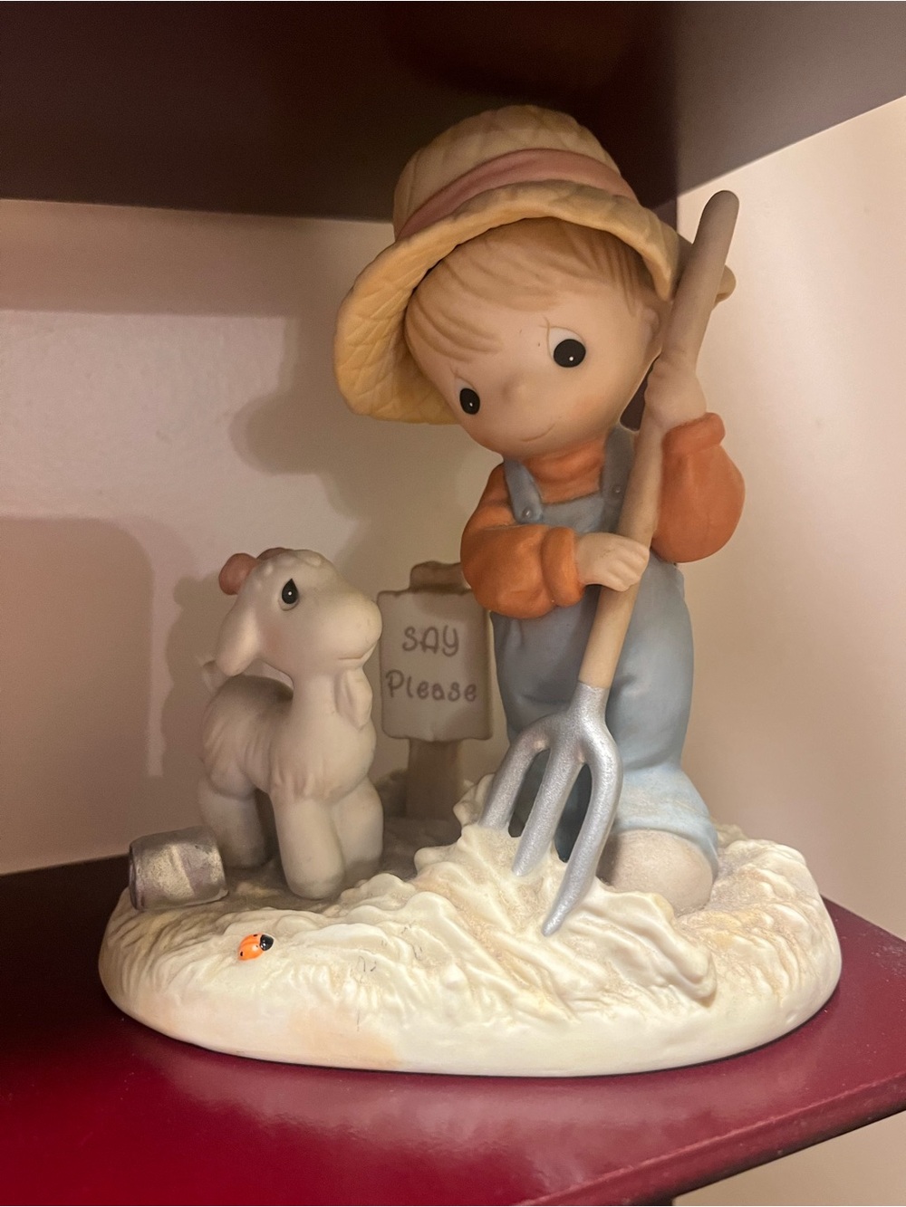 Enesco Precious Moments Figurine in Cream, Light Blue, Yellow, and Orange
